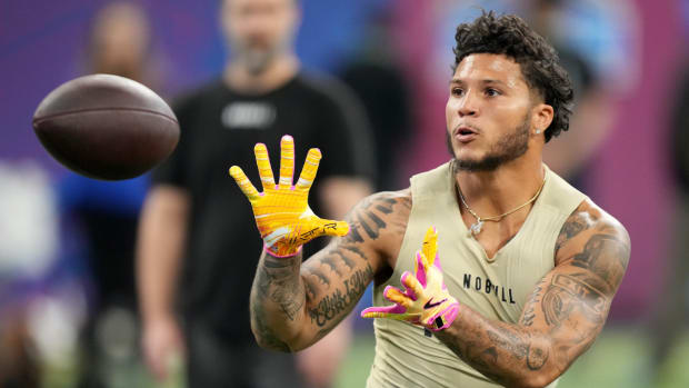 Michigan running back catches a ball during the NFL scouting combine.